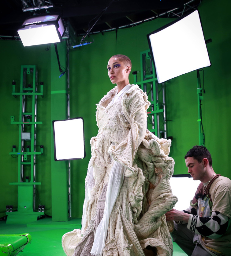 A model doing a runway walk on a greenscreen